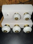 Set Of Sicura Kids White + Antique Brass Ornamental Drawer Pulls 1.5" Round. Fixed Price $16.99.