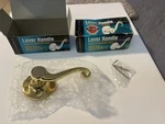 2 Ultra Hardware Scroll Series Dummy Lever Handle In Polished Brass, Model 44310. Fixed Price $15.00.