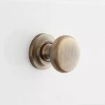 Signature Hardware 1-1/4" Brass Round Knob W/ Beveled Base Plate- Antique. Fixed Price $10.00.