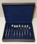 Vintage Cosmos Stainless 71 Piece Japan Flatware CSM39 Textured Handle Wood Case. Fixed Price $429.86.