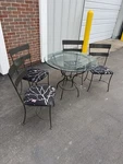Charleston Forge Wrought Iron Dining Set Round Glass Top Table & 4 Chairs. Fixed Price $638.00.