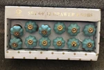 Set Of 12 Aqua Blue Ceramic Flower Shaped Drawer Knob With Gold Color Center. Fixed Price $45.00.