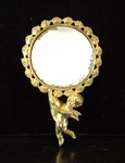Small Vintage Ornate Held Vanity Mirror With Cherub Handle Marked Vip. Fixed Price $20.00.