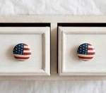 Warren Kimble American Flag Ceramic Knobs Pair Santa Barbara Design Vtg. Fixed Price $26.00.